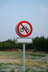 No cycling sign on a grassy field