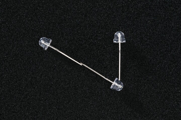 The number seven is laid out from small diode bulbs on a black background