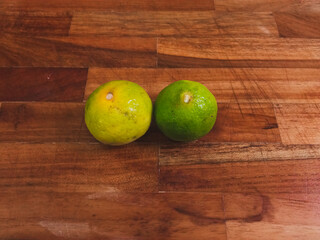 Limes on a wooden cutting board