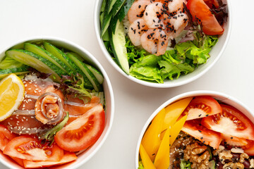 Tasty take out poke bowls isolated on white background