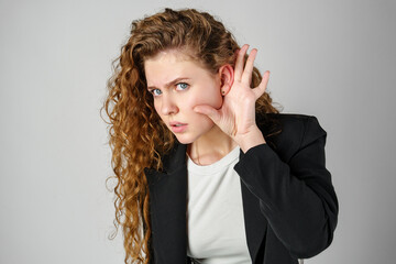 Young Woman Listening With Hand to Ear