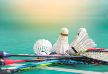 Badminton shuttlecocks on badminton rackets in badminton court soft and selective focus