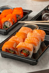 Close up of sushi rolls on gray table