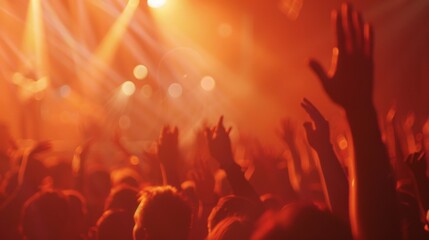 Blurred of Christian worship with raised hand, music concert 