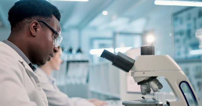 Scientist, black man and microscope or writing in laboratory for results on medical research and experiment. Notebook, professional and expert with notes on science development, study review and info