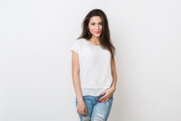 portrait of attractive young smiling woman in white blouse and jeans, long hair, fashion trend, simple apparel, natural look, casual style, isolated on studio background