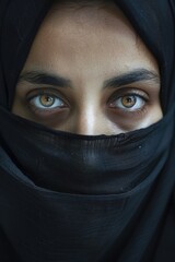 Naklejka premium A close-up view of a person wearing a black veil, suitable for use in scenes where a character is mourning or hiding their identity