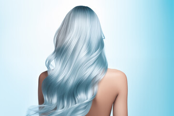 Fototapeta premium Captivating studio portrait of a woman with long, wavy blue hair. The pastel shades and aquatic theme give a mermaid-like effect.