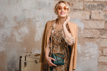 attractive stylish blonde woman in beige coat, spring autumn fashion trend