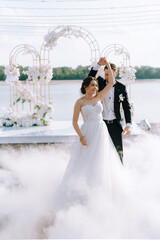 the first dance of the bride and groom inside a restaurant