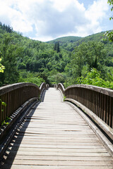 Obraz premium View of the bridge on a summer day. Location vertical. Castellfollit de la Roca. Spain.