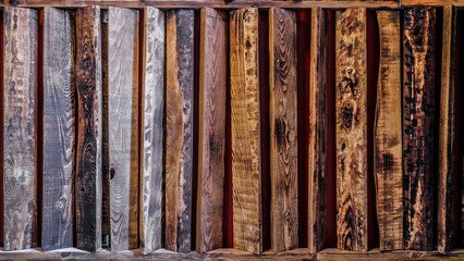 wooden structure with several wooden planks. The planks are vary in size and are placed in a way that they create a visually appealing pattern