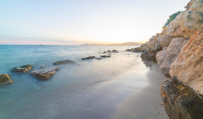 Rocks in the water in Sardinia at sunset