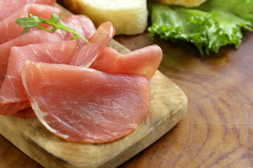 smoked ham of pork on a wooden board
