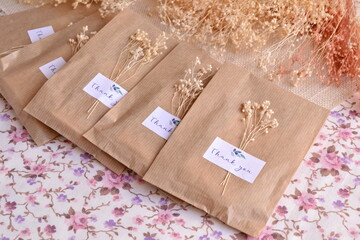 Wedding  celebration favors packaging in craft bags with custom label and dry flowers decoration, ecological party diy handmade souvenirs in natural color, guest small gifts easy ideas