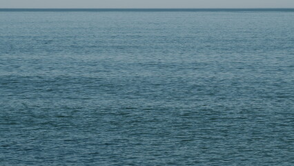 Obraz premium Ripples And Waves On Water Surface. Blue Waves Sea Water.