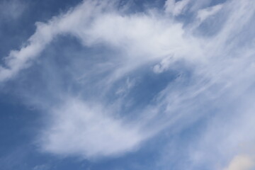 furry clouds over bright blue skies during the day