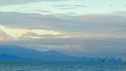 Obraz premium Silhouette Of A Metropolis By The Sea. Stunning Views Of The City Harbor. Batumi, Adjara, Georgia.