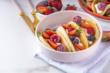 Pancake tacos, sweet breakfast tacos with whipped cream and berry