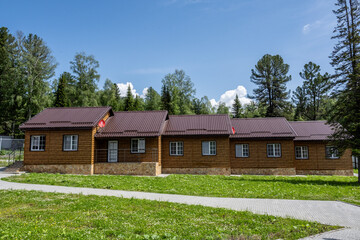 typical summer landscape with mountains, lake and forest in the area of ​​Lake Teletskoye in Altai