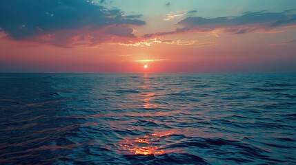 Obraz premium A realistic photograph of the beautiful red sunset over the blue sea on the twilight time