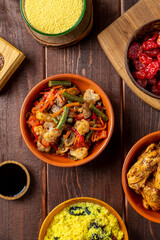Traditional lunch couscous with chofruits, vegetables, chicken in sauce and dried fruits