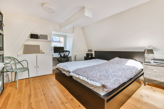 Cozy and modern attic bedroom with stylish decor