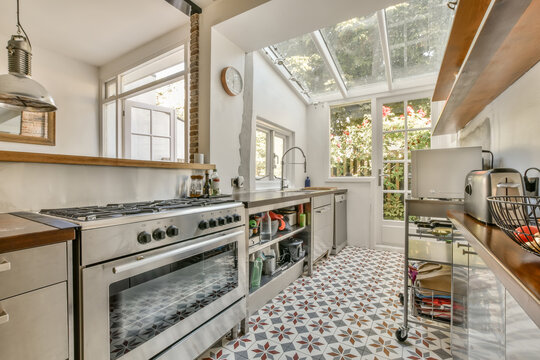 Bright kitchen with patterned tiles and natural lighting