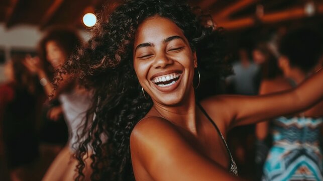 A joyful moment captured at a retro dance party with friends, featuring a woman with a beaming smile and dancing in a lively atmosphere.