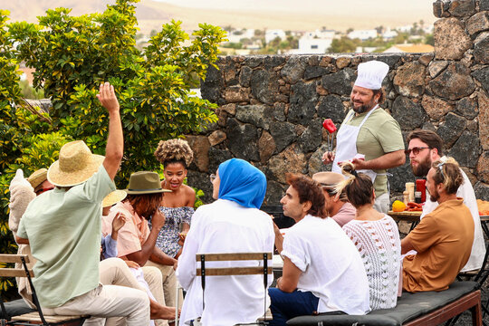 Friends enjoying a multiethnic BBQ gathering with music