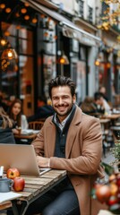 A focused entrepreneur working on a laptop at an outdoor cafe. The image has a warm, cinematic style with cozy autumn decorations and a bustling background.