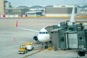 Airplane jet connected to terminal via jet bridge