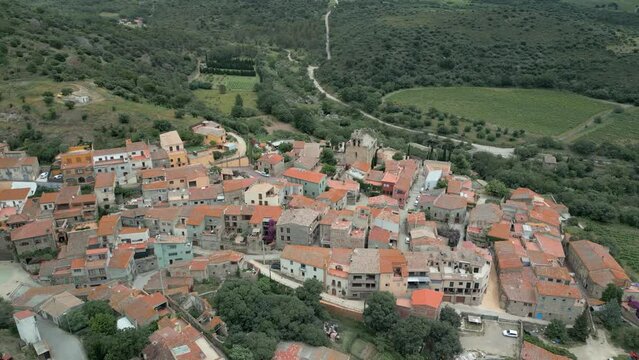 Aerial drone images of Rabos, a small medieval town in the mountains of Catalonia in Spain, surrounded by green vineyards