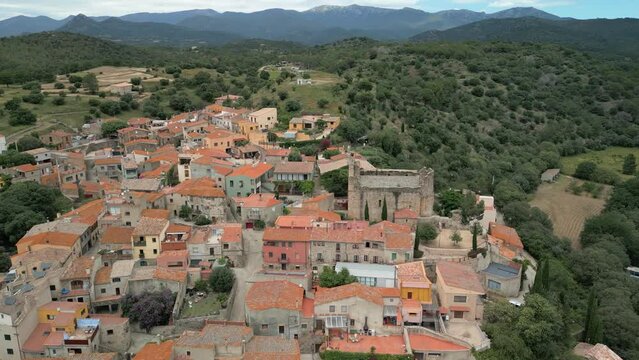 Aerial drone images of Rabos, a small medieval town in the mountains of Catalonia in Spain, surrounded by green vineyards