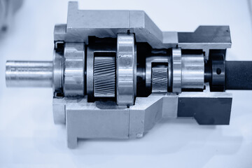 Sectional view of operation of mechanical gearbox with gears, car industrial mechanism background