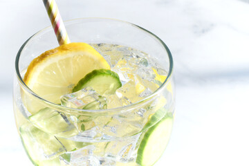 Spa detox water with slices of lemon and cucumber in it.