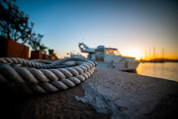 Close up view of a rope by the sea in a harbor