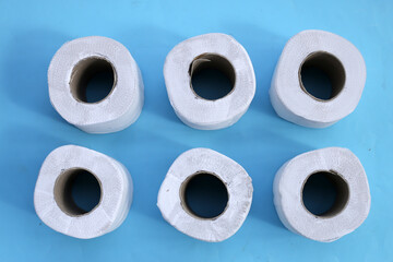 Toilet paper on blue background.