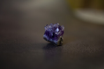 Violet amethyst quartz crystal on black background