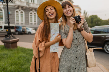 stylish young women traveling together summer fashion style dresses