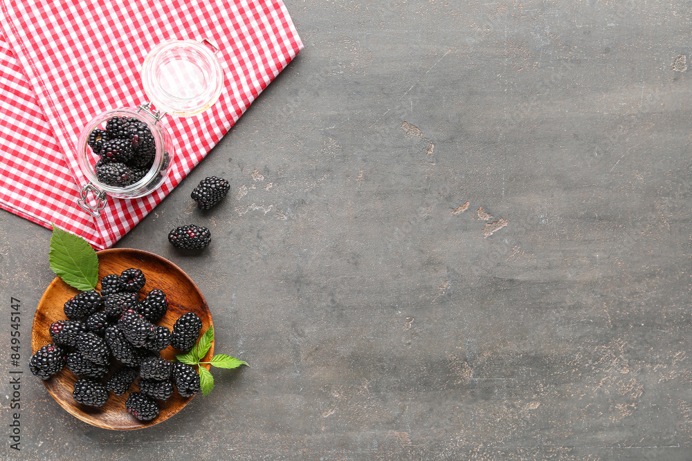 Poster wooden plate and jar with fresh blackberries on grey background - Posters