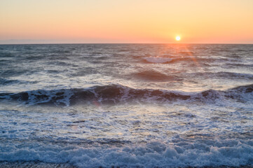 Obraz premium Sun rise at the beach. Sun rising at sea horizon. Golden hour.
