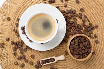 Cup of coffee made using pyramid on concrete background, top view