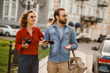 man and woman on romantic vacation walking together