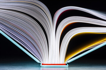 Open book on dark background