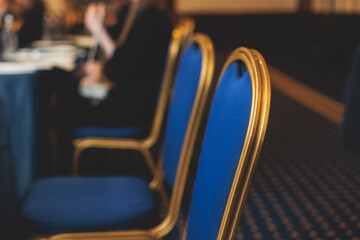 Audience at the modern conference hall listens to lecturer, people on a congress together listen to speaker on stage at master-class, corporate business seminar, venue for a congress forum event