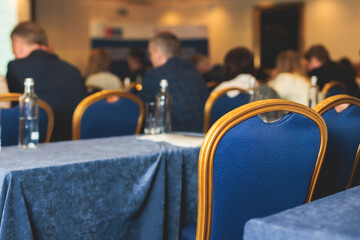 Audience at the modern conference hall listens to lecturer, people on a congress together listen to...
