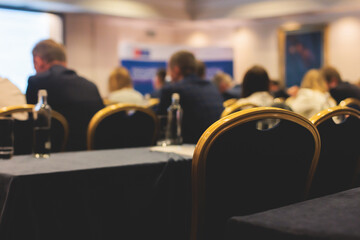 Audience at the modern conference hall listens to lecturer, people on a congress together listen to...
