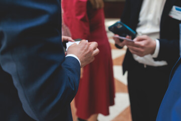 Group of men in business suits talking and discussing during coffee break at conference, politicians and entrepreneurs networking and negotiate, businessmen have a conversation dialog on a forum