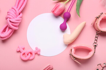 Blank card, sex toys and tulip flower on pink background